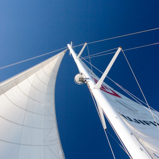 White Yacht sail and radio mast - Copy Space